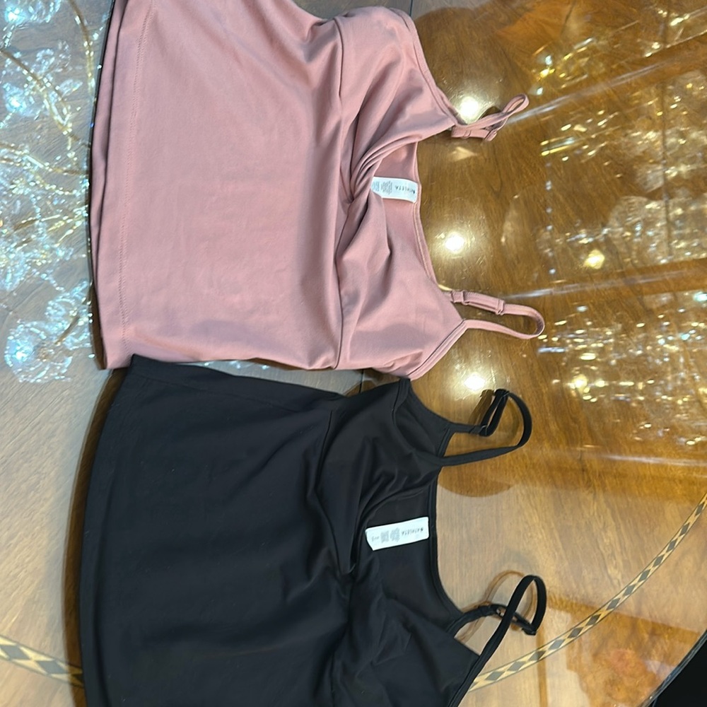 Two athletic tops size small petite
in pink and black.